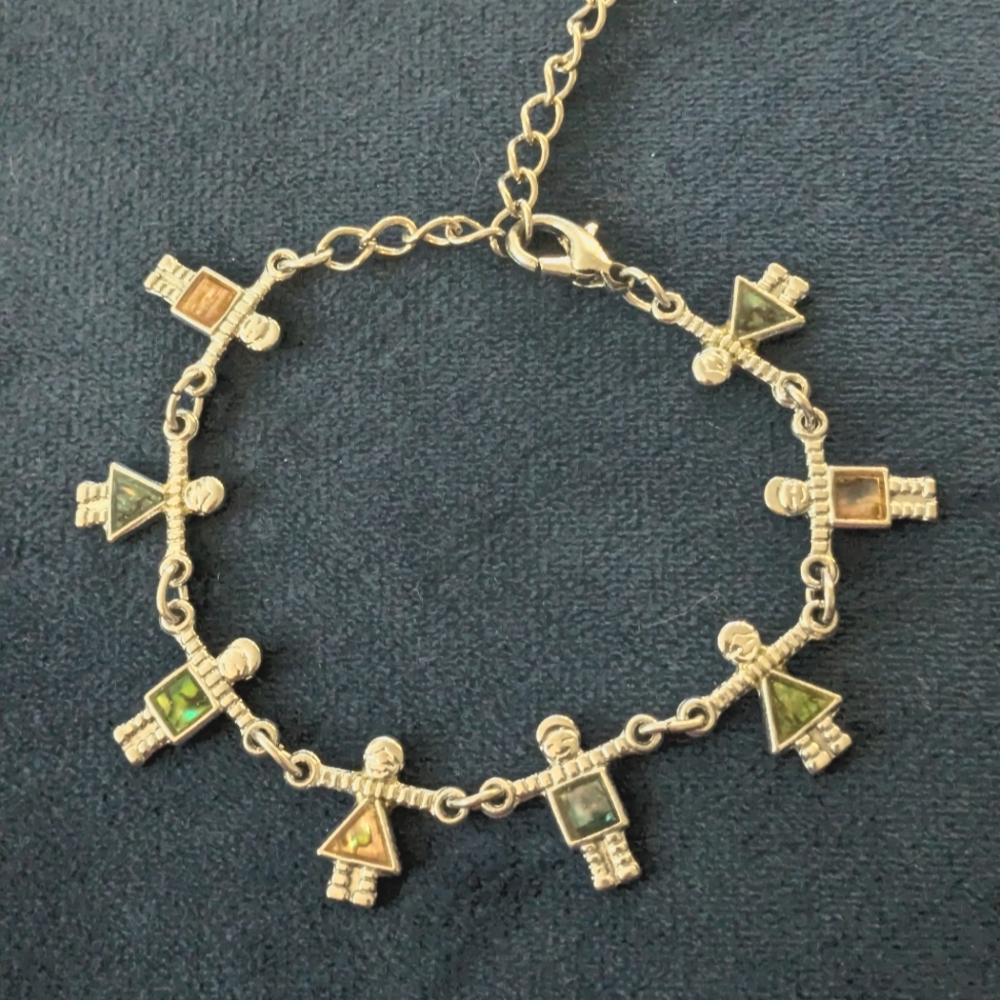 Silver Charm Bracelet with shell in lay Figures
